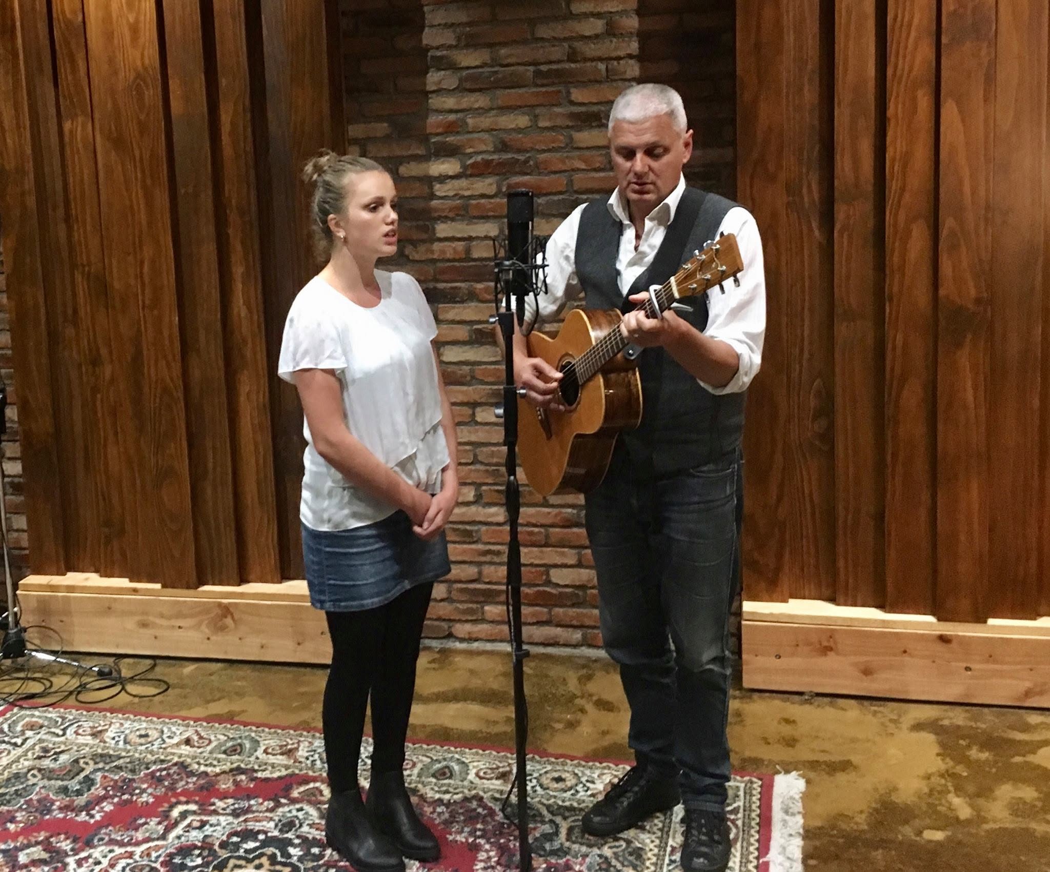 An adult beginner singing during a one-to-one singing lesson