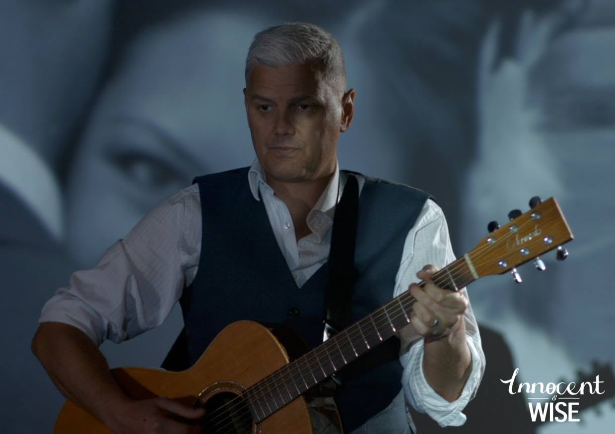 Cinematic blue music-video still from Ryan Edwards' Innocent & Wise